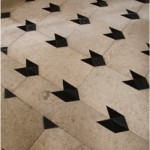 black and whiote marble floor with added black paper triangles